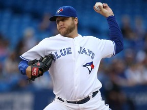 Jays starter Mark Buehrle delivers a pitch against the Boston Red Sox on August 15, 2013 at Rogers Centre in Toronto, Ontario, Canada. (Photo by Tom Szczerbowski/Getty Images)