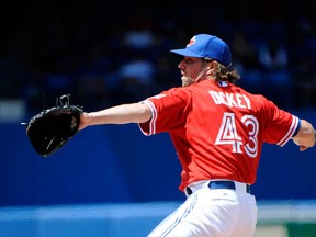 Toronto's R.A. Dickey pitches against Oakland during the first inning Sunday August 11, 2013 in Toronto. (THE CANADIAN PRESS/Jon Blacker)