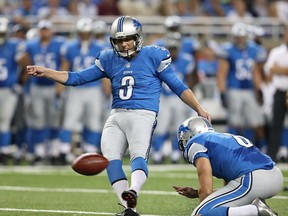 Detroit Lions kicker Havard Rugland, left, hits a 49-yard during pre-season action against the New York Jets at Ford Field August 9, 2013 in Detroit. (Leon Halip/Getty Images)