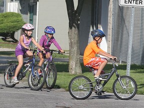 Competitors ride their bikes as part of the Kids of Steel Triathlon Camp held recently at Lacasse Park in Tecumseh. The annual camp headed by John McKibbon provides an introduction to the world of triathlons. (DAN JANISSE / The Windsor Star)