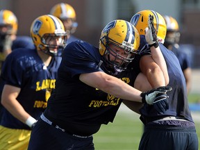 The University of Windsor Lancers Jeremy Rogers practices at Alumni Field in Windsor on Monday, August 20, 2013.       (TYLER BROWNBRIDGE/The Windsor Star)