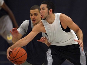 Windsor Lancers Reda Souala, left, defends Roland Shannanhous during practice Monday at the St. Denis Centre on August 12, 2013.  (NICK BRANCACCIO-The Windsor Star)