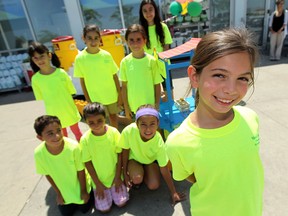 Maya Marie Michael, right, sells lemonade with her friends in front of the Superstore on Walker Road in Windsor on Friday, August 9, 2013. (TYLER BROWNBRIDGE/The Windsor Star)
