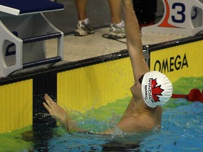 Windsor-Essex swimmer Aaron Norg celebrates after finishing second in  the boys 50m backstroke at the International Children's Games at the Windsor International Aquatic and Training Centre,  Friday, August 16, 2013.  (DAX MELMER/The Windsor Star)