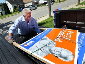 Windsor/Tecumseh by-election winner Percy Hatfield collects election signs on Friday , August 2, 2013.             (TYLER BROWNBRIDGE/The Windsor Star)
