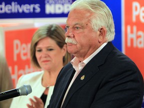 Percy Hatfield delivers his victory speech while NDP leader Andrea Horwath stands by his side after Hatfield won the byelection for Windsor-Tecumseh on August 1, 2013 in Windsor, Ontario. (JASON KRYK/The Windsor Star)