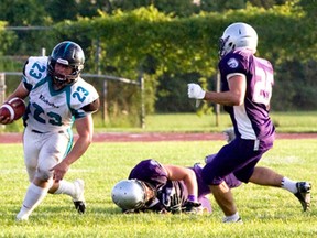 Raven running back Cody McCann, left,  outruns the London defence in last week’s OVFL conference semifinal. McCann will play his last game in Essex tonight when the Ravens host Niagara in the conference finals at Raiders Field at 7 p.m. (JOEL BOYCE/The Windsor Star)