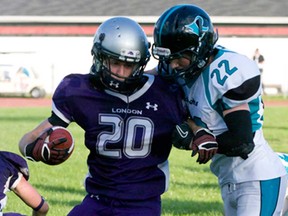 Essex Raven Jack Susko, right, attempts to tackle London's Mackenzie Ferguson during OVFL playoff action in Essex Saturday. (JOEL BOYCE/The Windsor Star)