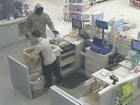 An image from a security video showing a man who robbed the Shoppers Drug Mart at 3100 Howard Ave. in Windsor on Aug. 10, 2013. (Handout / The Windsor Star)