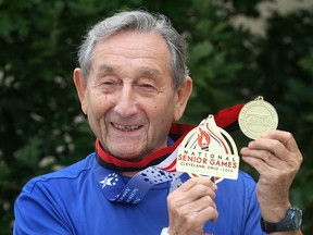 Al Nelman displays some of his prized medals. (DAN JANISSE / The Windsor Star)
