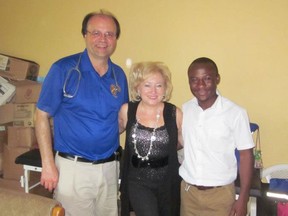 Dr. Chris Spirou, left, Kim Sprirou, and Fidelis, a Nurse Practitioner who works at the clinic in Assin Bereku Ghanaan, on the Rotary Club's trip to  Ghana, Africa on November 1, 2012.