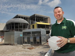 Ted Beale, athletic coordinator at the St. Clair College in Windsor, Ont. poses in front of the Sportsplex construction project Friday, Aug. 30, 2013. The facility is one of several new sports and recreation projects in the region. (DAN JANISSE/The Windsor Star)