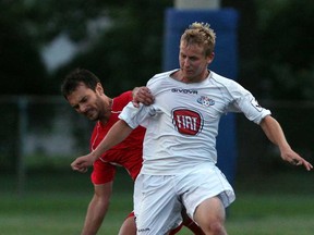 Chad Stuecher, right, of the Windsor Stars battles London City's Nedad Begovic during Canadian Soccer League action at Windsor Stadium August 9 , 2013. (NICK BRANCACCIO/The Windsor Star)