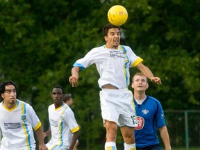 York Region Shooters midfielder Francisco Javier Perez, centre, leaps for the ball in front of Windsor's Michael Watson on Sunday, Aug. 11, 2013 at Windsor Stadium. The Windsor Stars shut out the Shooters 1-0. (JOEL BOYCE / The Windsor Star)