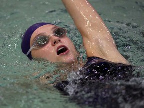 Local swimmer Zoe Mercier practises the backstroke at at University of Windsor pool in preparation of International Children's Games. (NICK BRANCACCIO/The Windsor Star)