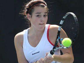 Team Canada's Silvia Verebes of Windsor returns a shot during a match Thursday, Aug. 15, 2013, against Taja Glazer of Slovenia at the International Children's Games at the Parkside Tennis Club. (DAN JANISSE/The Windsor Star)