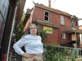 Helen Wolfe stands near the backyard of her home at 816 Howard Ave. Photographed Aug. 22, 2013. (Jason Kryk / The Windsor Star)