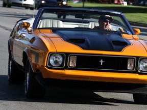 Cars participate at the 18th annual Woodward Dream Cruise on Aug. 18, 2012 in Ferndale, Mich. (Associated Press Photo/Detroit Free Press, Jessica J. Trevino)