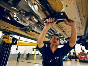 A file photo of a mechanic working on a vehicle in Toronto. (Postmedia News)