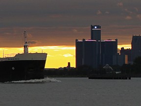 Lake freighter Sam Laud heads upstream on the Detroit River with the Windsor skyline on the left and the Detroit, Michigan skyline on the right, Monday October 3, 2011. (NICK BRANCACCIO/The Windsor Star)