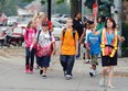 Last September's General Brock students Kyleigh Mallen, 10, left, Zack Freeswick, 11, Kale Mallen,11, Curtis Mathis, 8, get help to cross the street from crossing guard Joanne Westfall on September 4, 2012. (NICK BRANCACCIO/The Windsor Star)