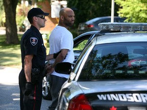Windsor Police arrest a 27-year-old man on Jamaica Court in South Windsor after executing search warrants throughout Windsor in relation to drug trafficking investigations Thursday September 5, 2013.  (NICK BRANCACCIO/The Windsor Star)