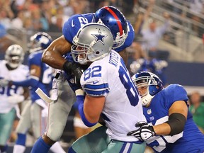 Tight end Jason Witten #82 of the Dallas Cowboys makes a 15-yard touchdown catch against the New York Giants in the second quarter on Sunday, Sept. 8, 2013 at AT&T Stadium in Arlington, Texas.  (Ronald Martinez/Getty Images)