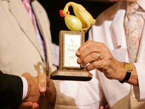 An Ig Nobel award is presented during a ceremony at Harvard University in Cambridge in 2007. The annual no-rules awards ceremony, where flying paper airplanes and interrupting honoured speakers are commonplace, pokes fun at bizarre and improbable achievements in real-life scientific research. The Ig Nobel is an annual award given by Annals of Improbable Research magazine for weird, wacky and sometimes worthless scientific research. (AP Photo files)