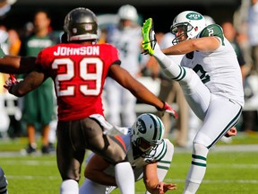Kicker Nick Folk #2 of the New York Jets kicks the game winning 48 yard field goal with two seconds left in the fourth quarter during a game against the Tampa Bay Buccaneers at MetLife Stadium on September 8, 2013 in East Rutherford, New Jersey. The Jets defeated the Bucs 18-17. (Photo by Rich Schultz /Getty Images)