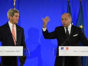 French Foreign Affairs Minister Laurent Fabius, right,  and U.S. Secretary of State John Kerry give a press conference at the ministry in Paris, on September 7, 2013. Kerry traveled to Europe to court international support for a possible strike on the Syrian regime for its alleged use of chemical weapons while making calls back home to lobby Congress where the action faces an uphill battle. (LIONEL BONAVENTURE/AFP/Getty Images)