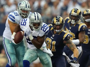 DeMarco Murray #29 of the Dallas Cowboys runs the ball against the St. Louis Rams at AT&T Stadium on September 22, 2013 in Arlington, Texas.  (Photo by Ronald Martinez/Getty Images)