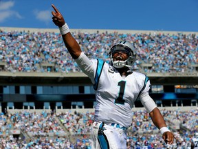 Cam Newton #1 of the Carolina Panthers celebrates after scoring a touchdown against the New York Giants during their game at Bank of America Stadium on September 22, 2013 in Charlotte, North Carolina.  (Photo by Streeter Lecka/Getty Images)