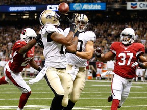 Robert Meachem #17 of the New Orleans Saints catches a touchdown pass over  Jerraud Powers #25 of the Arizona Cardinals at the Mercedes-Benz Superdome on September 22, 2013 in New Orleans, La.  (Photo by Chris Graythen/Getty Images)