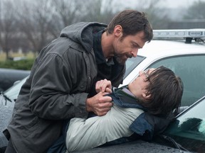 Hugh Jackman, left, and Paul Dano in a scene from "Prisoners." The Warner Bros. thriller, which also stars Jake Gyllenhaal, got the fall moviegoing season off to a strong start over the weekend, opening with a box office-leading $21.4 million, according to studio estimates Sunday.
(AP Photo/Warner Bros. Pictures, Wilson Webb)