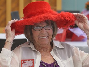 The Red Roses of Windsor held a farewell luncheon Sat. Sept. 21, 2013, at the Centres for Seniors in Windsor. The group was bidding farewell to being red hatters and moving on to being a new social group called the "Twisted Sisters." Shirley Crapper adjusts her hat during the event.  (DAN JANISSE/The Windsor Star)
