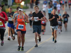 Runners participate in the World Alzheimer's Day Run For Heroes Marathon on Front Rd. in Amherstburg, Ont., Sunday, Sept. 22, 2013.  The race helps to benefit programs provided by the Alzheimer Society of Windsor and Essex County.  (DAX MELMER/The Windsor Star)