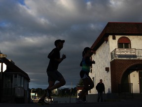Runners participate in the World Alzheimer's Day Run For Heroes Marathon on Front Rd. in Amherstburg, Ont., Sunday, Sept. 22, 2013.  The race helps to benefit programs provided by the Alzheimer Society of Windsor and Essex County.  (DAX MELMER/The Windsor Star)
