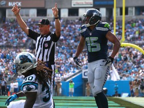 Jermaine Kearse #15 of the Seattle Seahawks celebrates after scoring a touchdown late in the game to put the Seahawks in the lead against Charles Godfrey #30 of the Carolina Panthers during their game at Bank of America Stadium on September 8, 2013 in Charlotte, North Carolina.  (Photo by Streeter Lecka/Getty Images)
