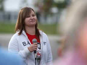 Ashley Malowaniuk, 24, the guest of honour for the event, speaks to the crowd before the start of LaSalle's Terry Fox Run at the Volmer Complex, Sunday, Sept. 15, 2013.  Malowaniuk has been cancer-free for nearly ten years after being diagnosed with the same type of cancer as Terry Fox.  (DAX MELMER/The Windsor Star)