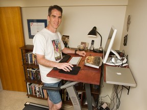 Children's author Arthur Slade on his desk treadmill in June 2009 in Saskatoon. (Postmedia News files)