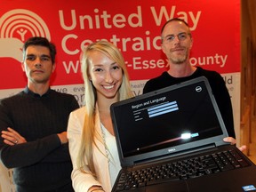 Friday the 13th proved to be a good day for Amanda Best, who received a Dell laptop from Doug Sartori, left, and jason Pomerleau of Parallel 42 Systems, part of the United Way Campaign Kickoff program at Ciociaro Club of Windsor Friday. On her own since she was 16, Best was assisted by Voluntary Trusteeship Program, a United Way sponsored program. She stayed in school and will be attending the University of Windsor. (NICK BRANCACCIO/The Windsor Star)