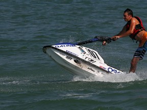 Jet skier Will Parkolab shows some of his moves on his stand-up jet ski on a warm September morning on Lake St. Clair at Lakeview Park Marina Tuesday September 10, 2013.  (NICK BRANCACCIO/The Windsor Star)
