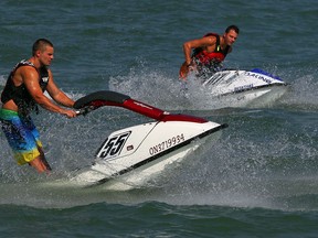 Jet skiers Troy Morley, left, and Will Parkolab enjoy a warm September morning on Lake St. Clair at Lakeview Park Marina Tuesday September 10, 2013.  (NICK BRANCACCIO/The Windsor Star)