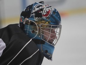 Windsor Spitfires goaltender Dalen Kuchmey takes a break during practice at the WFCU Centre. (JASON KRYK/The Windsor Star)