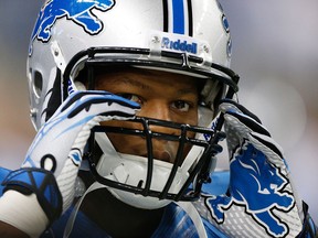 Detroit's Ndamukong Suh adjusts his helmet during a game against the Minnesota Vikings at Ford Field on September 8, 2013 in Detroit, Michigan. (Gregory Shamus/Getty Images)