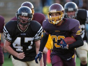 Catholic Central's Terrance Crawford, right, runs with the football against Riverside in 2008. (Jason Kryk/The Windsor Star)