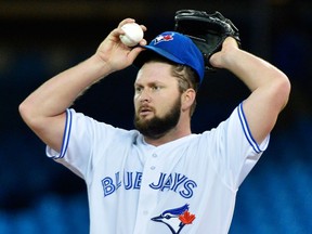 Toronto pitcher Todd Redmond takes a break against the Baltimore Orioles Friday (THE CANADIAN PRESS/Nathan Denette)