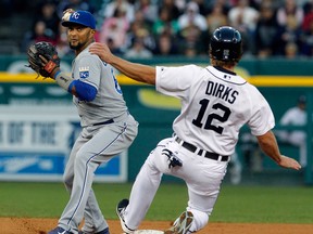 Royals second baseman Emilio Bonifacio, left, gets the force out on Andy Dirks of the Tigers in the second inning at Comerica Park Friday. Photo by Duane Burleson/Getty Images)