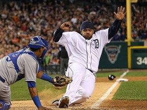 Detroit's Prince Fielder, right, is tagged out at home by Royals catcher Salvador Perez in the ninth inning to end the game at Comerica Park Saturday. (Photo by Leon Halip/Getty Images)