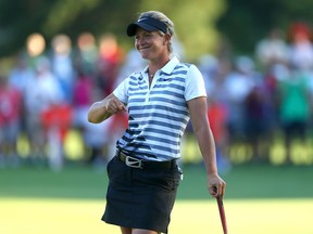 Suzann Pettersen of Norway smiles on the 18th hole after shooting 20 strokes under par to win during the final round of the Safeway Classic on September 1, 2013 at Columbia Edgewater Country Club in Portland, Oregon.  ( Jonathan Ferrey/Getty Images)